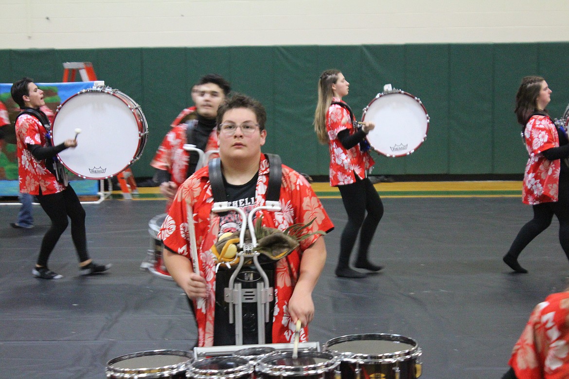 Bass and tenor drummers work out the spacing for the Othello High School drumline program prior to last weekend’s performance.