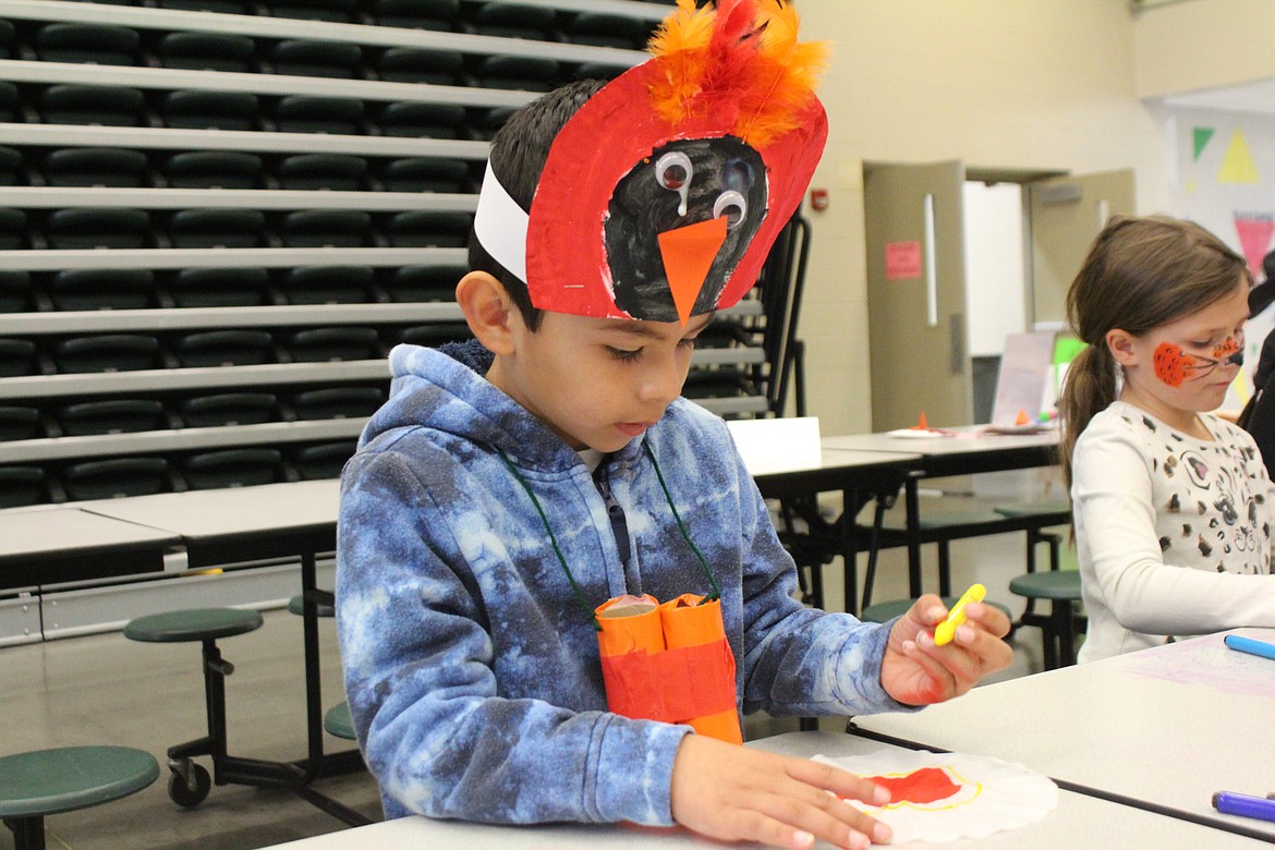 Isaiah Zuniga works on a bird-themed craft Saturday during the Othello Sandhill Crane Festival.