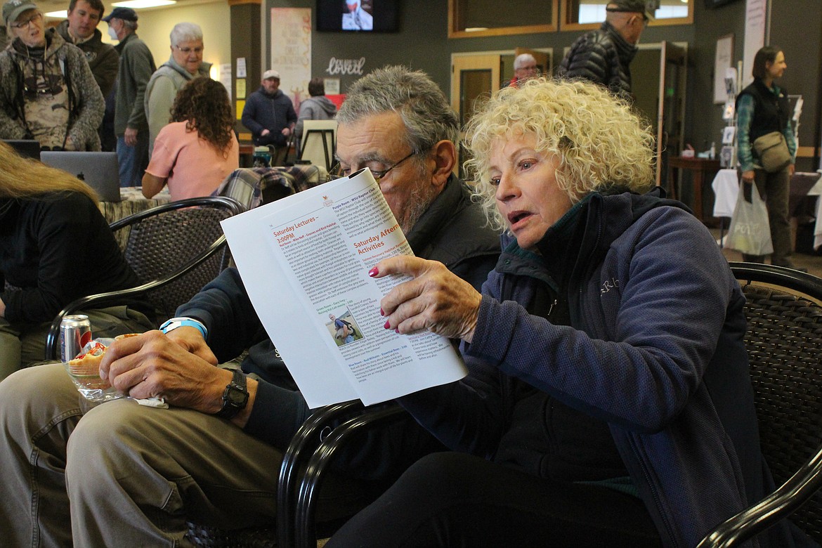 Debb Reiley looks over the classes and activities in the Othello Sandhill Crane Festival brochure. The festival celebrated its 25th annual event this past weekend.