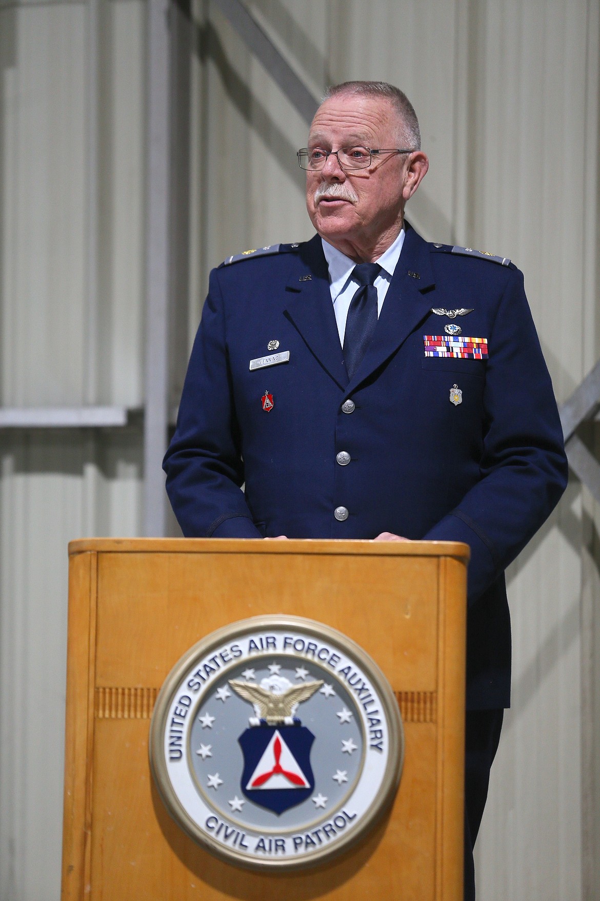 Outgoing Civil Air Patrol Coeur d'Alene Composite Squadron Commander Maj. Michael Venning delivers a farewell speech Tuesday night during a change of command ceremony in the squadron hangar at Pappy Boyington Field in Hayden. Venning will go on to be the Idaho Wing director of logistics.