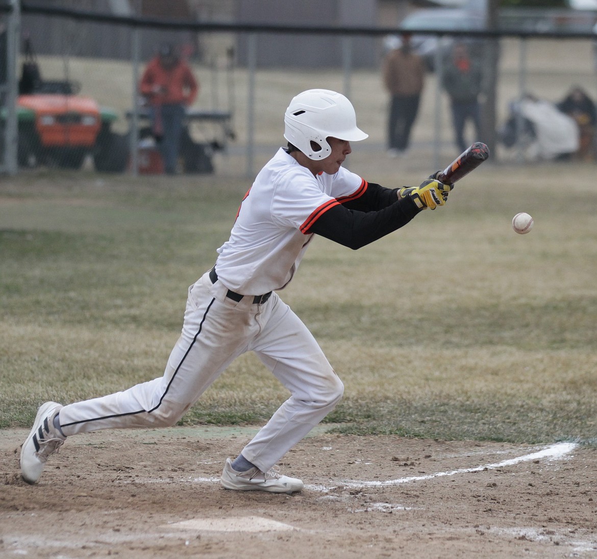 JASON ELLIOTT/Press
Post Falls senior shortstop Langan Naylor puts down a successful bunt during the fifth inning of Wednesday's Inland Empire League game against Sandpoint at Post Falls High.