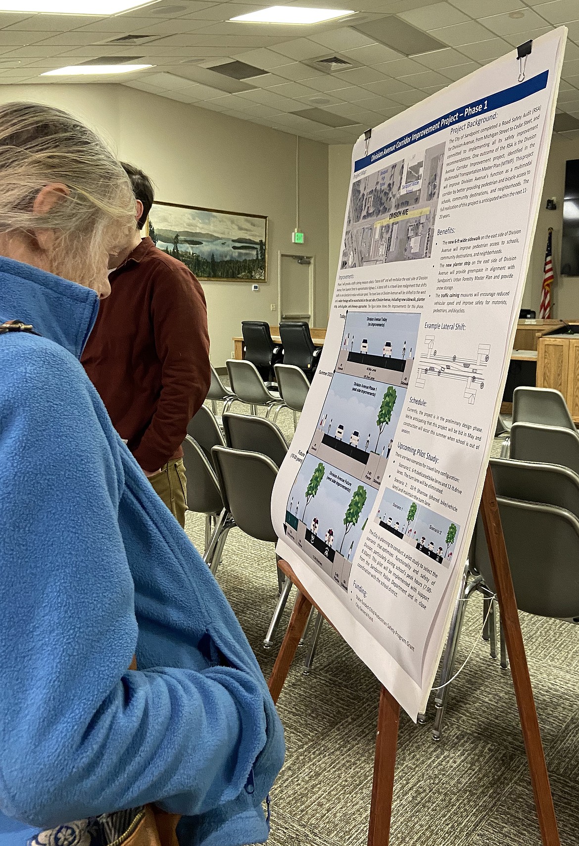 A resident examines one of the information sheets detailing the Division Corridor Project at Wednesday's open house event seeking input on the project.