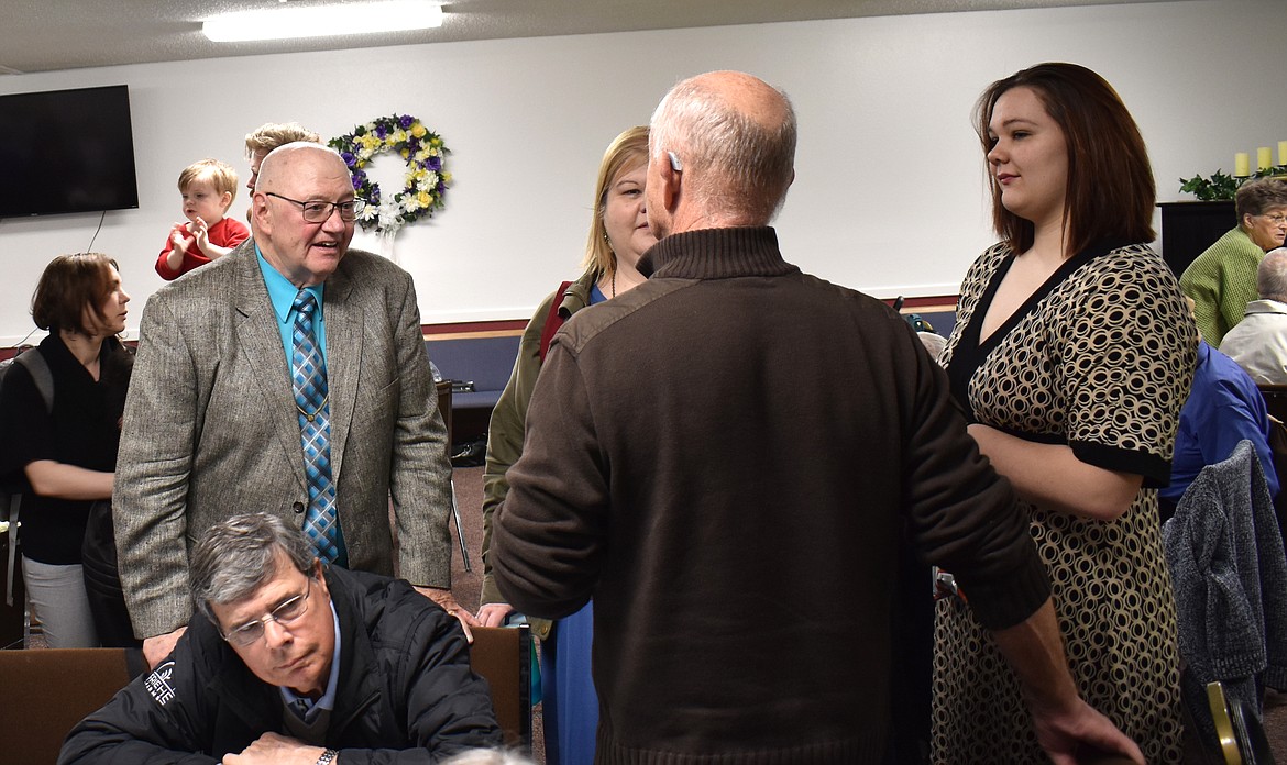 Pastor Floyd Wilks, left, visits with some well-wishers at his retirement celebration Sunday at Moses Lake First Church of the Nazarene.