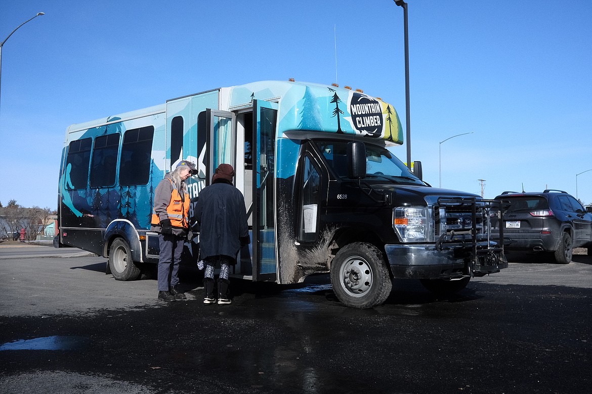 A Flathead Warming Center guest boards the Mountain Climber bus on March 8, 2023. The Warming Center is Flathead County's only low-barrier overnight homeless shelter, open from October to April. (Adrian Knowler/Daily Inter Lake)