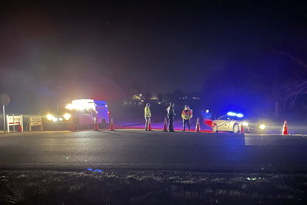 Emergency responders are seen near a site where two military helicopters crashed Wednesday night during a routine training mission in Trigg County, in southwestern Kentucky, on March 30, 2023. (Brandon Smith/WSMV-TV via AP)