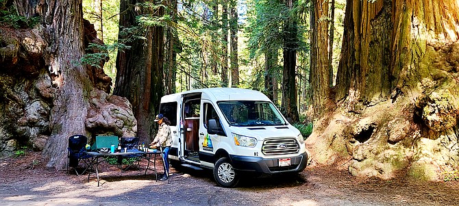 A camper unpacks some camping accessories from a Wandervan in Redwood National Park. Coeur d'Alene natives Jon Latorre and Nick Leonard partnered with CEO of Wandervans Chris Cook to expand and build the company's reach into the Pacific Northwest and nationally through franchising.