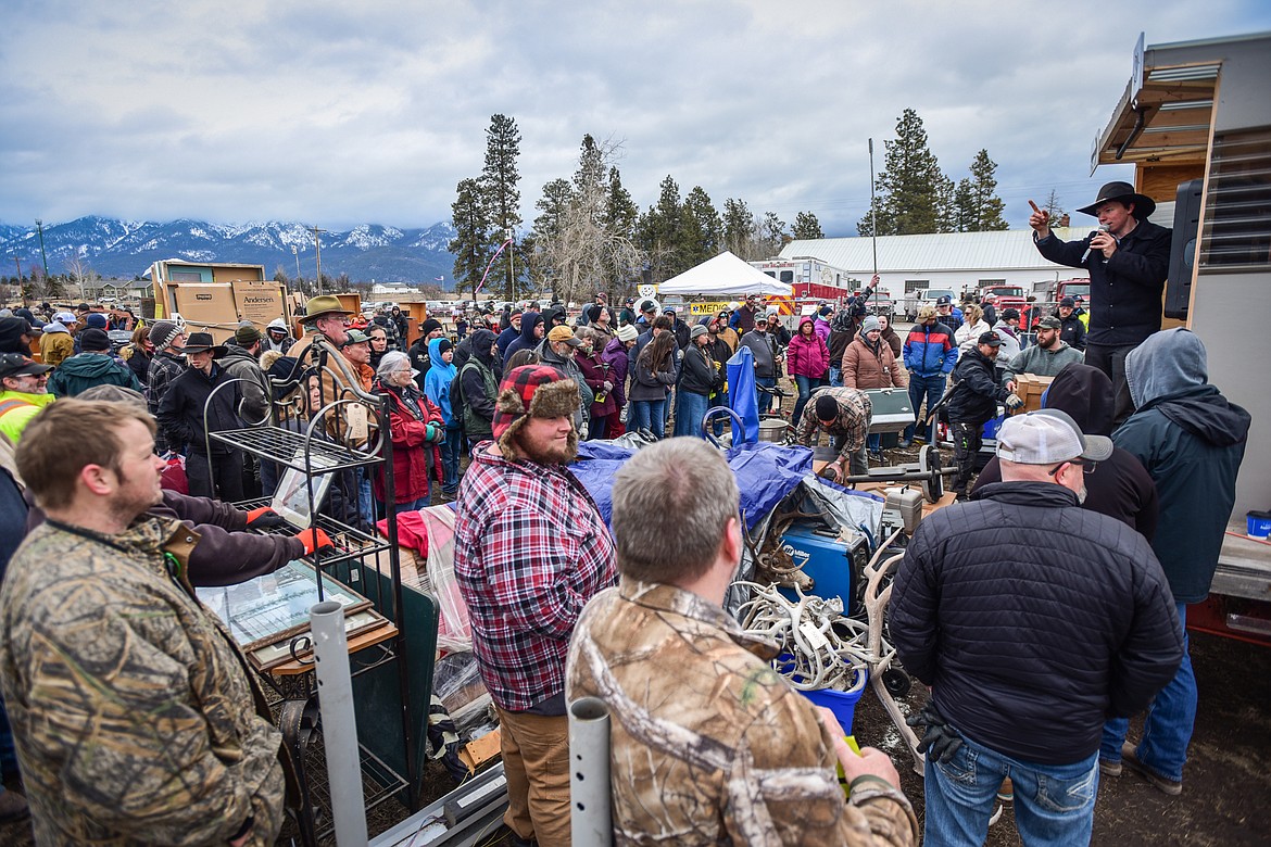 Shoppers bid on items up for auction at the 57th annual Creston Auction on Saturday, April 1. The Creston Auction and Country Fair is the largest annual fundraiser for the all-volunteer Creston Fire Department and has been held in Creston since 1966. (Casey Kreider/Daily Inter Lake)