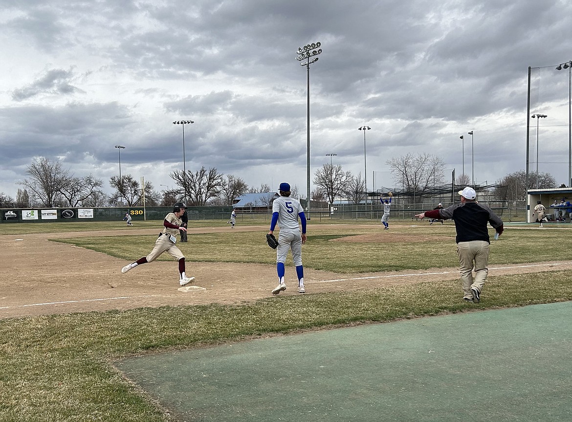 A Mavs runner rounds third base on his way to score during a game against the Eisenhower Cadets on Friday.