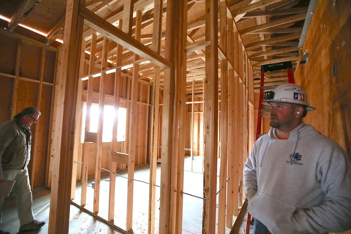 Foreman/journeyman Tyler McGreal with Fuse Electric on Monday discusses electrical aspects of the expansion at the Boys & Girls Club in Post Falls.