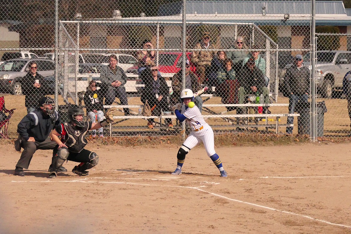 Thompson Falls batter Olivia Fitchett eyes a pitch from Plains pitcher Piper Bergstrom during the first inning of their game last week to open the 2023 season.   (Chuck Bandel/VP-MI)