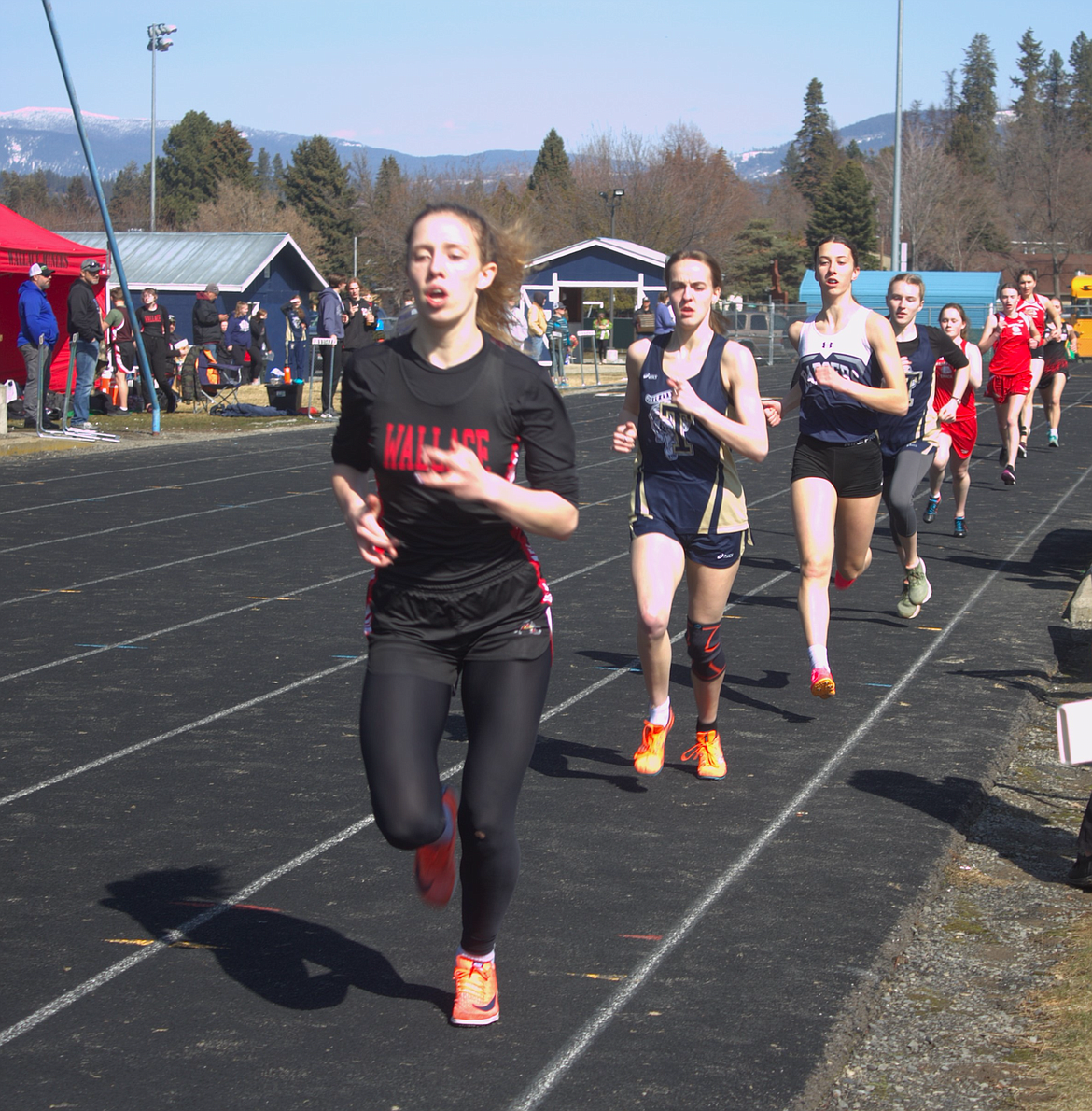 Wallace's Kayla Hasz leads the pack during the 800-meter race at Bonners Ferry High School.