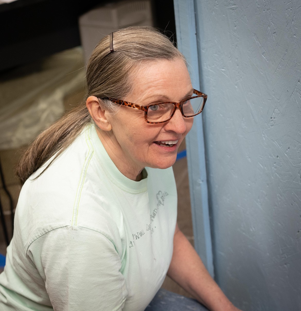 Volunteer painter Neva Thompson helps out at the Plains Community Food Bank. (Tracy Scott/Valley Press)