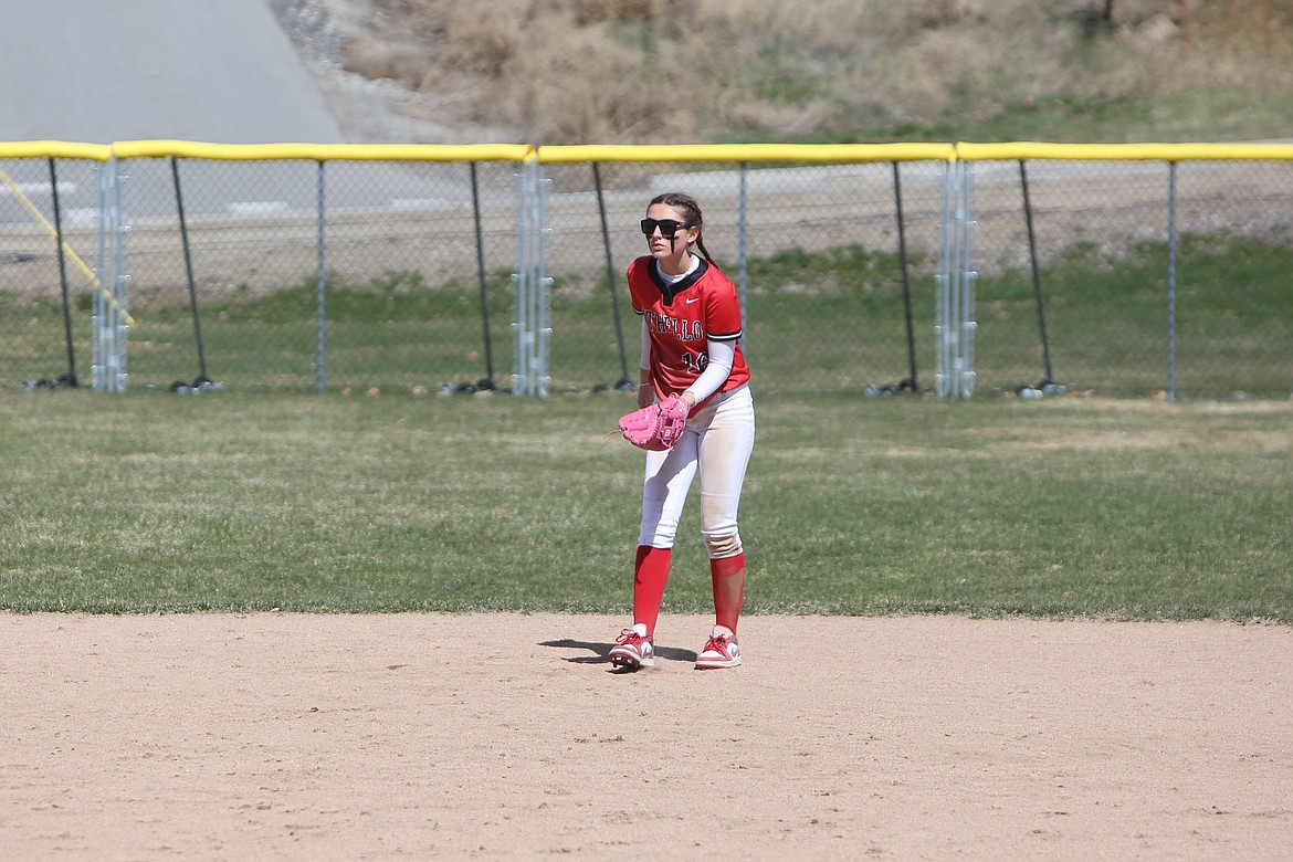 Othello senior Camryn McDonald waits for a pitch in the infield. McDonald recorded three hits and three RBI, including a two-run home run in the top of the seventh inning.