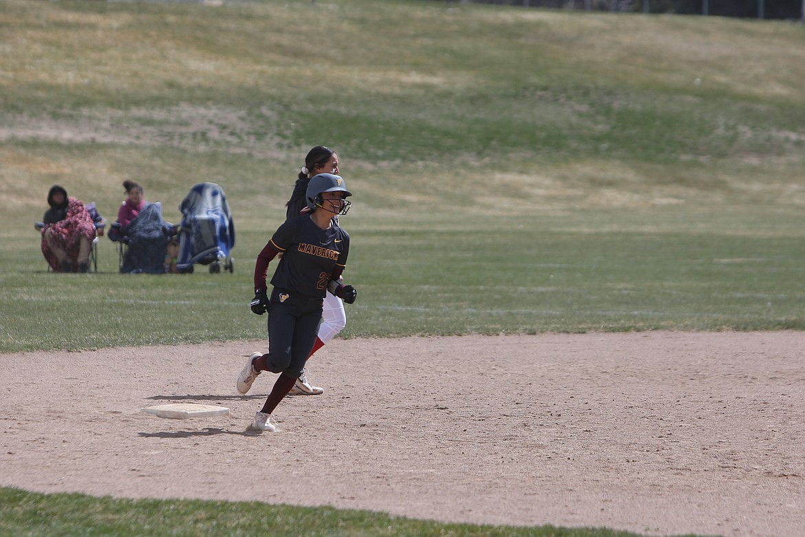 Moses Lake senior Annalyse Hernandez smiles as she rounds second base after hitting a two-run home run in the sixth inning against Othello.