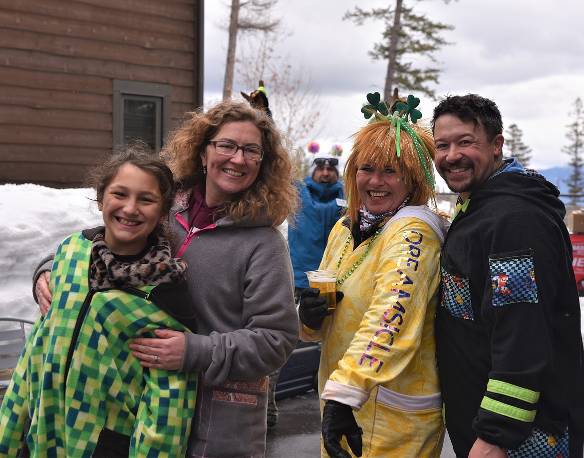 DREAM Adaptive's Trevor Hildebrand photo bombs some party goers at the Shred-a-Thon last Saturday. (Julie Engler/Whitefish Pilot)