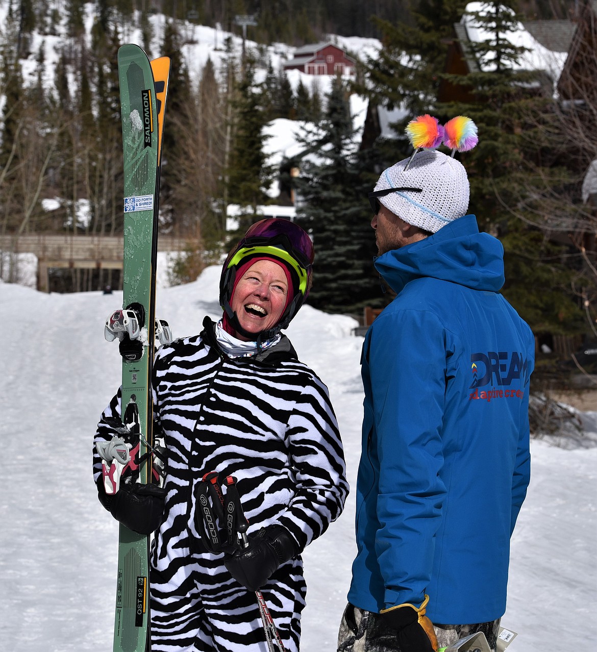 A skiing zebra shares a laugh with a DREAM staff member on Saturday on the Big Mountain. (Julie Engler/Whitefish Pilot)