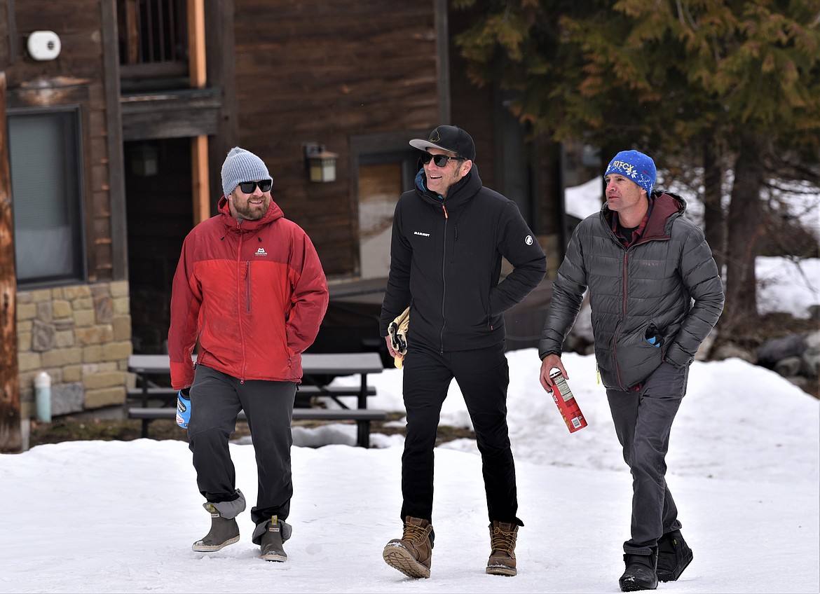 David Steele, Chance Cooke and Jeff Brown walk to the Shred-a-Thon party after Cooke and Brown completed 11 uphill laps in 10 hours on Saturday. (Julie Engler/Whitefish Pilot)