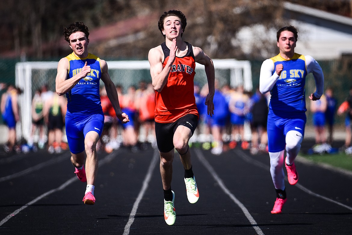 Flathead's Brody Thornsberry races to a first-place finish in the boys 100 meter dash during a track meet with Whitefish and Missoula Big Sky high schools at Legends Stadium on Tuesday, April 4. (Casey Kreider/Daily Inter Lake)