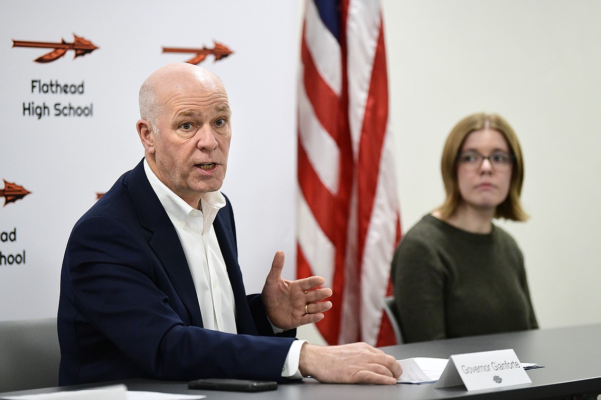 Gov. Greg Gianforte addresses members of a roundtable discussion regarding the importance of expanding individualized, work-based learning opportunities in Montana schools at Flathead High School on Wednesday, April 5. At right is Flathead High School student Selah Conklin. (Casey Kreider/Daily Inter Lake)