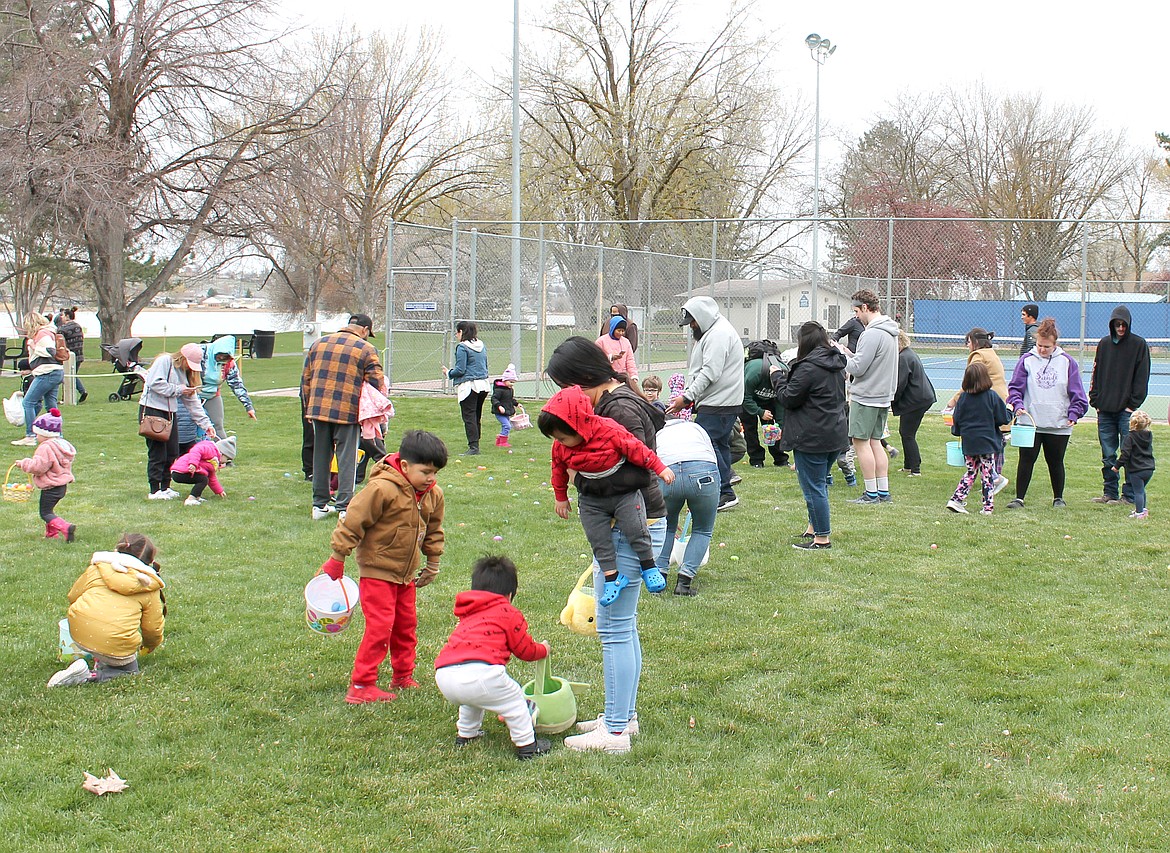 Children descend on McCosh Park Saturday for the 2022 Easter egg hunt sponsored by the Moses Lake Lions Club. The hunt started at noon and all the eggs had been snapped up by 12:04.