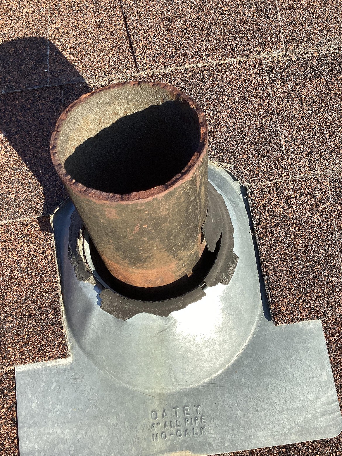 The boot on this roof vent is largely missing, which spells water damage down the road if it’s not repaired.