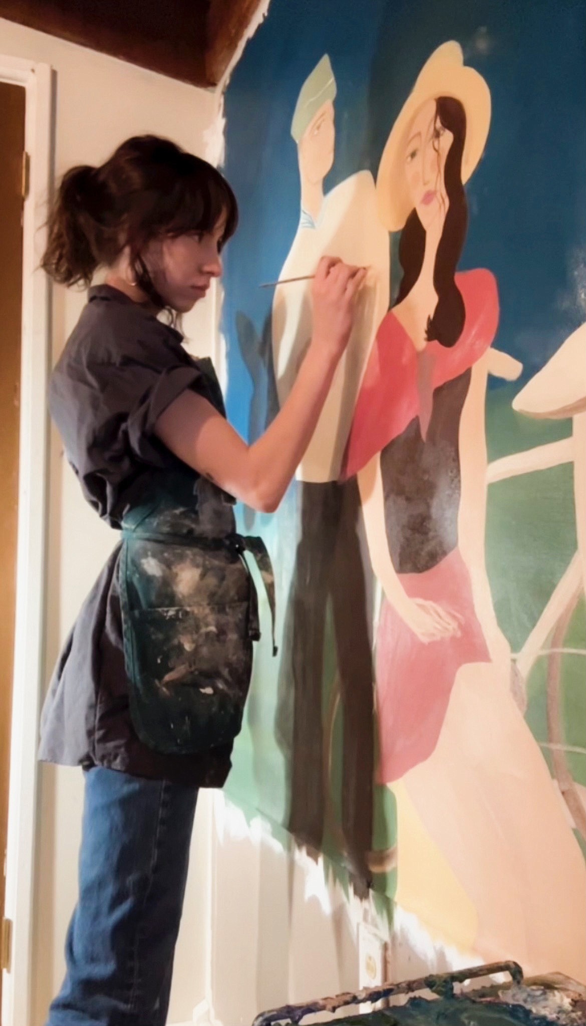 President of the Aspiring Artists Club, Anneliese Slattery, paints a mural. The president collaborates through the art club to present the Spring 2023 Art Show exhibition in the Edminster Student Union Building at North Idaho College opening April 12.