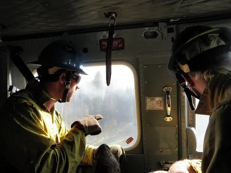 Wildland firefighters observe an area. (Photo courtesy of Lucas Stacy)