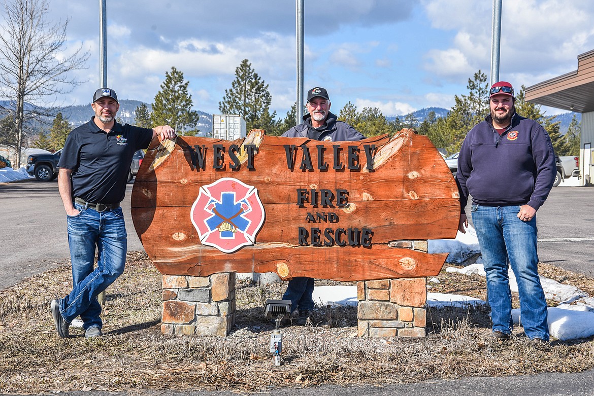 Justin Kaber, left, Lincoln Chute, middle, and Sean Bohannan, pose for a portrait outside of West Valley Fire and Rescue on March 27, 2023. (Kate Heston/Daily Inter Lake)