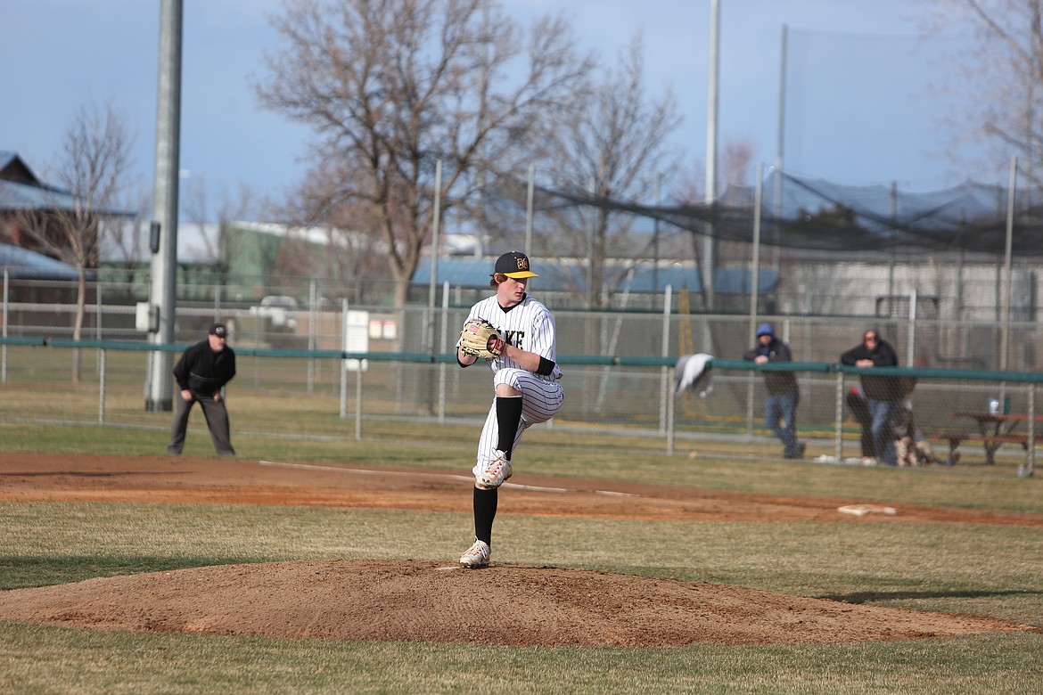 Moses Lake pitcher Michael Getzinger starts his pitching motion during the first inning against Eastmont on Tuesday.