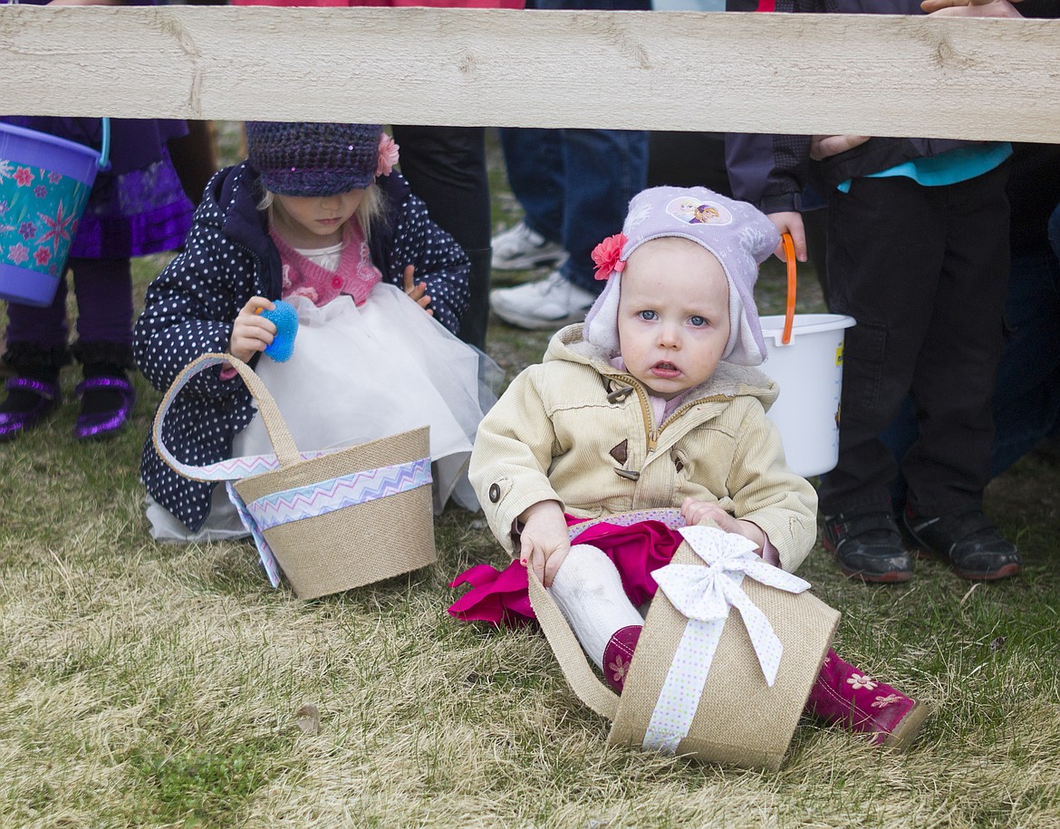 Clara and Elsa Gregorash wait for the Lions Club Easter egg hunt to start in 2016. (Hungry Horse News photo)