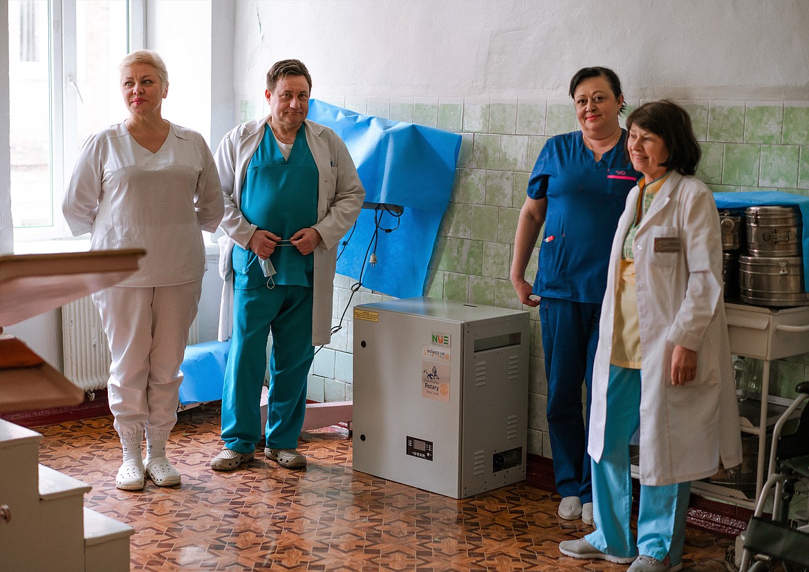 Staff at the Kharkiv Regional Clinical Perinatal Center with one of the two generators they received this March. (Photo provided)