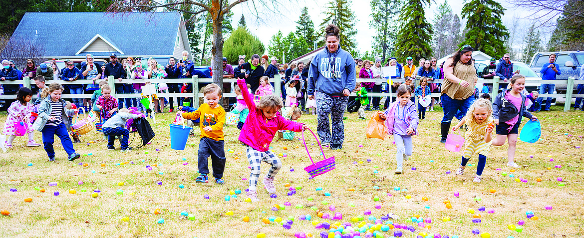 Youngsters race for Easter eggs during the Lions Club egg hunt in 2021. (Hungry Horse News photo)