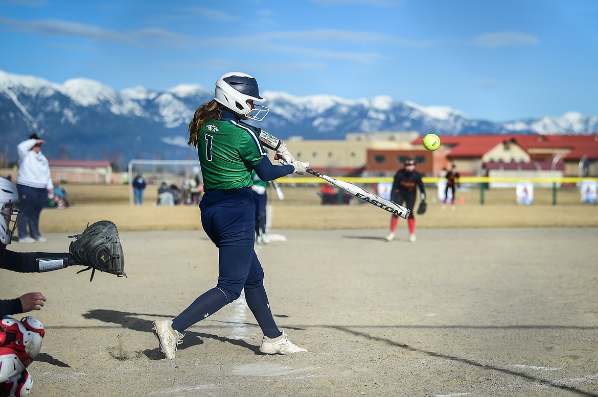 Glacier's Brooklyn Imperato (1) drives in a run in the second inning against Missoula Hellgate at Glacier High School on Thursday, April 6. (Casey Kreider/Daily Inter Lake)