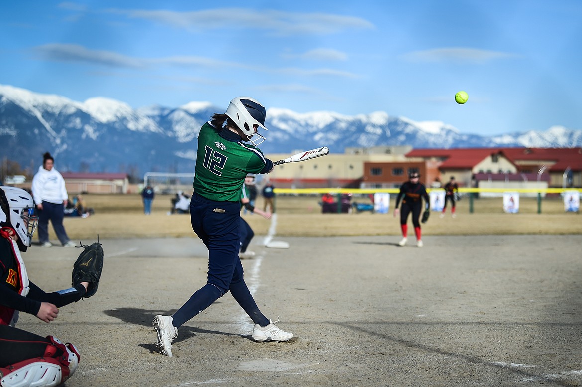 Glacier's Ella Farrell (12) drives in a run in the second inning against Missoula Hellgate at Glacier High School on Thursday, April 6. (Casey Kreider/Daily Inter Lake)
