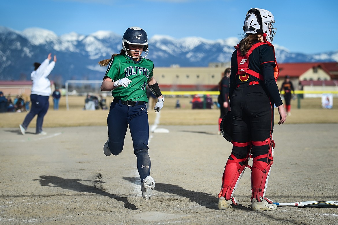 Glacier's Khristen Terrell (9) scores a run in the first inning off a hit by Avery Anderson against Missoula Hellgate at Glacier High School on Thursday, April 6. (Casey Kreider/Daily Inter Lake)