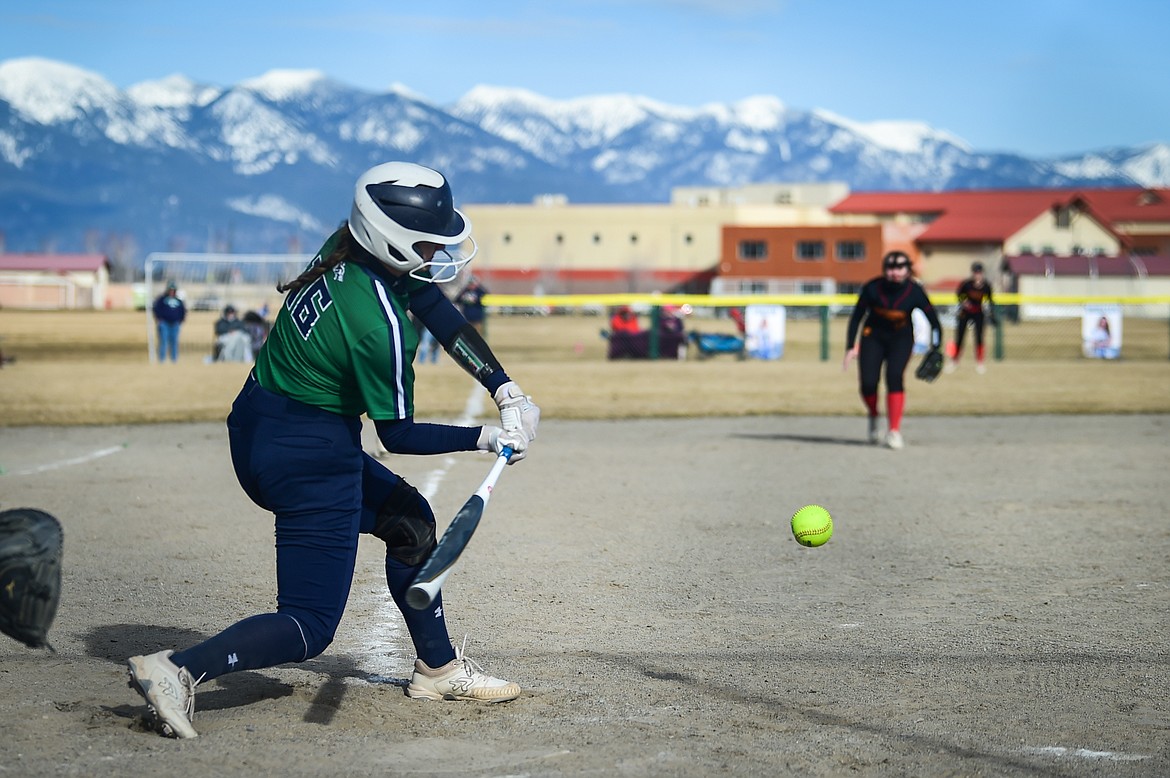 Glacier's Avery Anderson (16)) drives in a run in the second inning against Missoula Hellgate at Glacier High School on Thursday, April 6. (Casey Kreider/Daily Inter Lake)