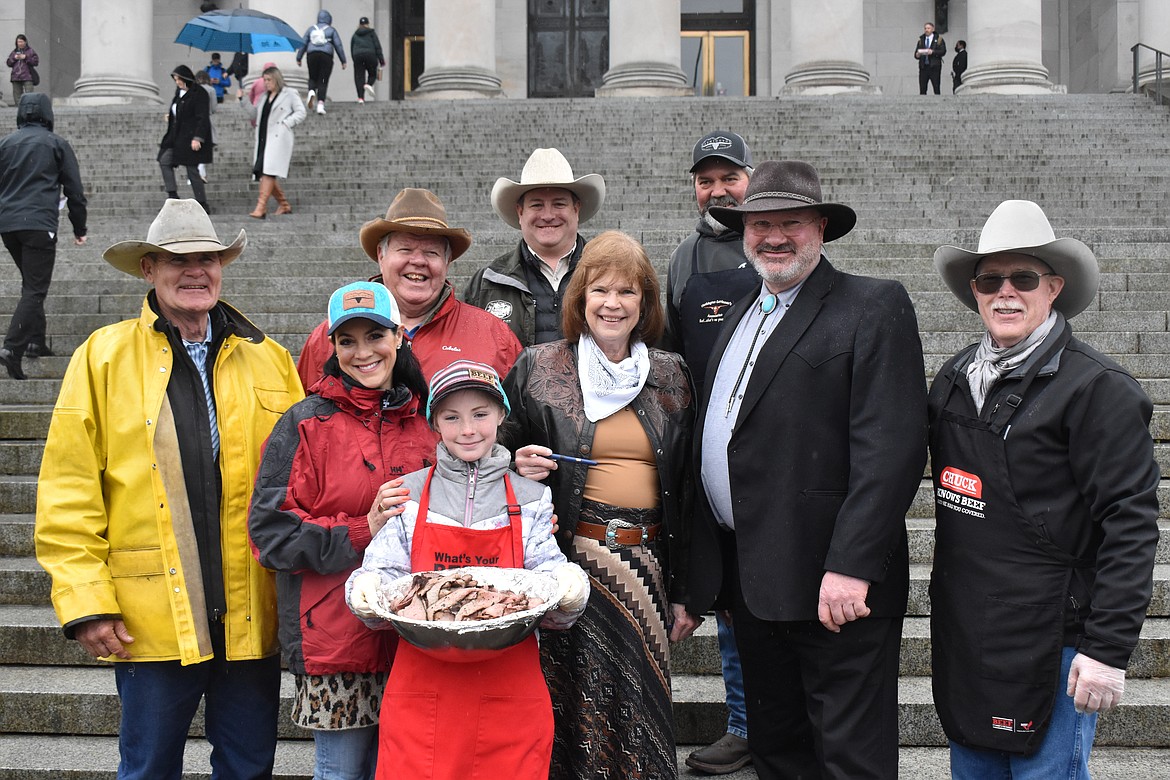 Local legislator Sen. Judy Warnick (R-Moses Lake), center with the white handkerchief, made sure to get her tri-tip and photos with volunteers at the event.