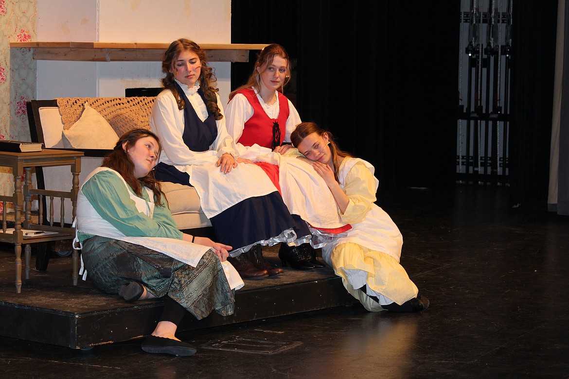 The March sisters, from left, Beth (Calissa Dalton), Jo (Madeline O’Neil), Meg (Evan Arledge) and Amy (Paisley Ashton) think of their absent father in the Moses Lake High School production of “Little Women,” opening Friday.