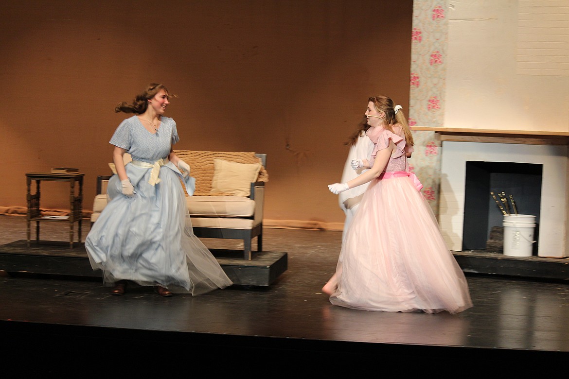 Jo (Madeline O’Neil), left, and Meg (Evan Arledge) dance in the Marsh living room prior to the ball.