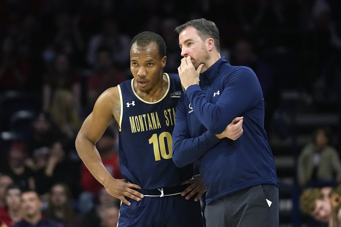 Montana State head coach Danny Sprinkle during the first half of an NCAA college basketball game against Arizona, Tuesday, Dec. 20, 2022, in Tucson, Ariz. (AP Photo/Rick Scuteri)