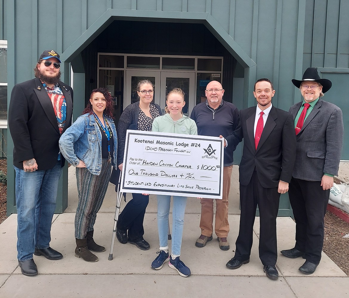 Kootenai Masonic Lodge No. 24, AF & AM of Idaho, partnering with the Idaho Freemason Foundation, presents a $1,000 grant on Friday to Hayden Canyon Charter to sponsor the sixth grade Hayden Canyon Charter Student-Led Wilderness Expeditionary Program. From left: Joel Johnson, Heather Ekhoff, Mallory Melee, Remi Palmer-Sherman, Bill Rutherford, Dan LaVine and B. Calvin Saul.