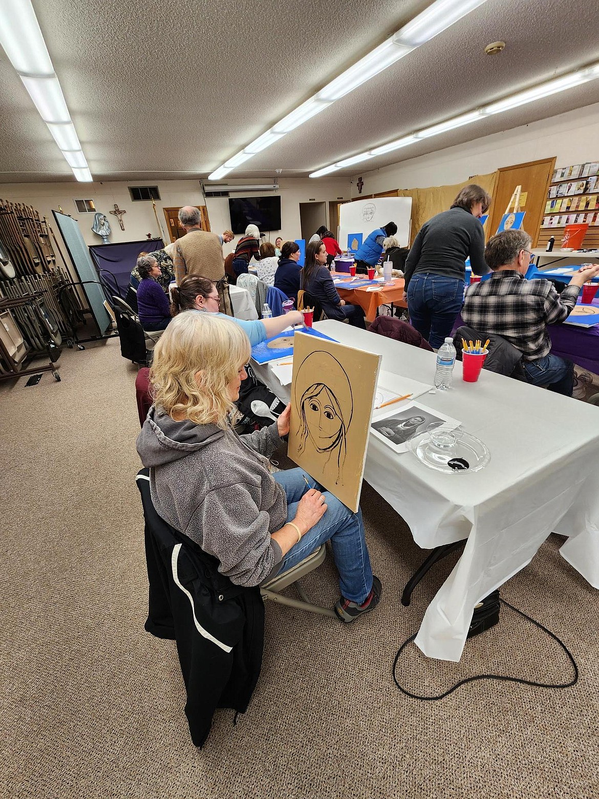 A painting class is held in a hall in St. George's Catholic Parish in Post Falls. The church has launched a three-year, $3.7 million "Making a Place to Gather and Grow” capital campaign to add 16,000 square feet to nearly double the parish's space.