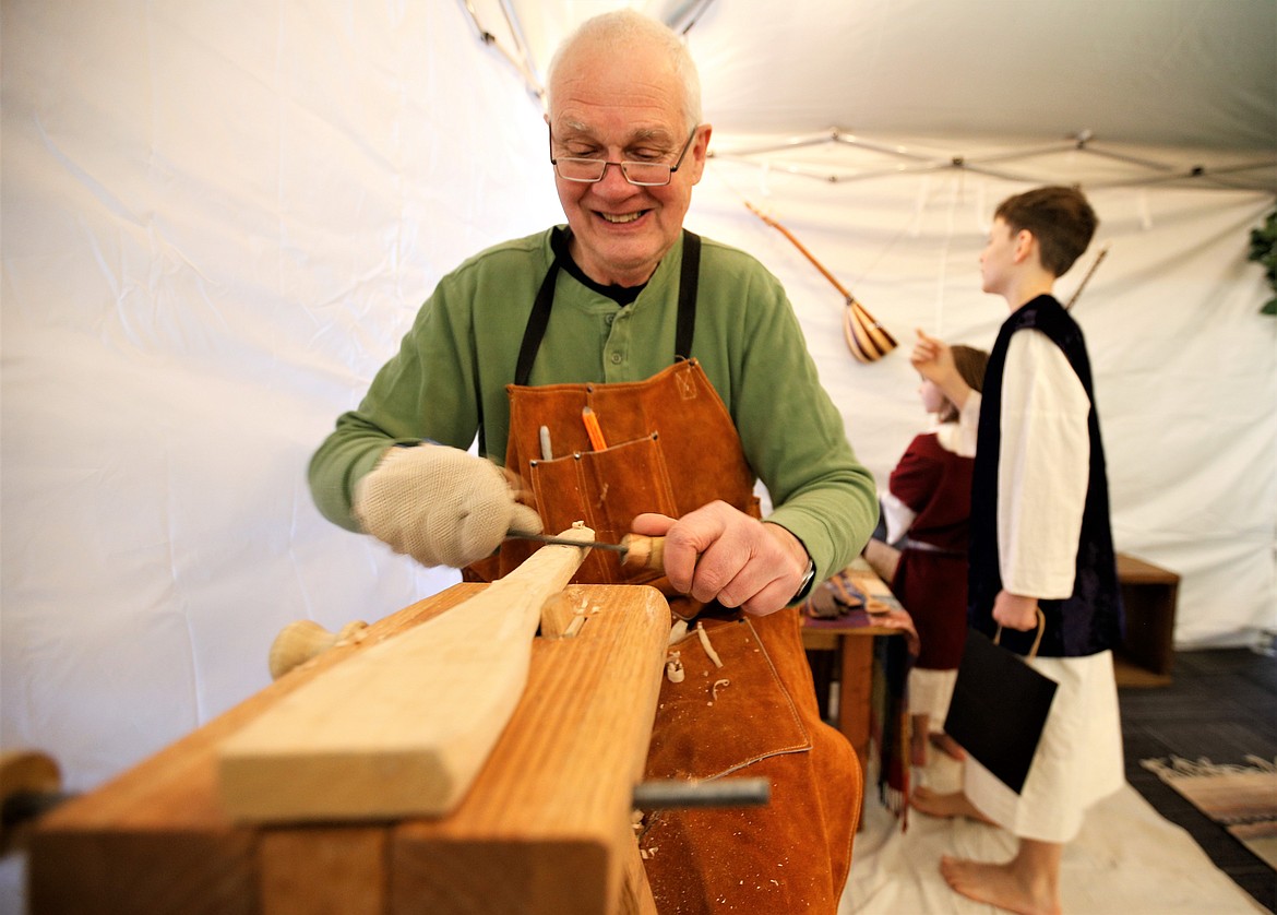 Ron Stout plays the role of a carpenter in the Bible Village at Coeur d'Alene Seventh-day Adventist Church on Friday.