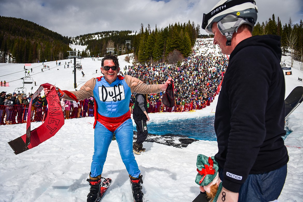 Competitors celebrate after a run at Whitefish Mountain Resort's pond skim on Saturday, April 8. (Casey Kreider/Daily Inter Lake)