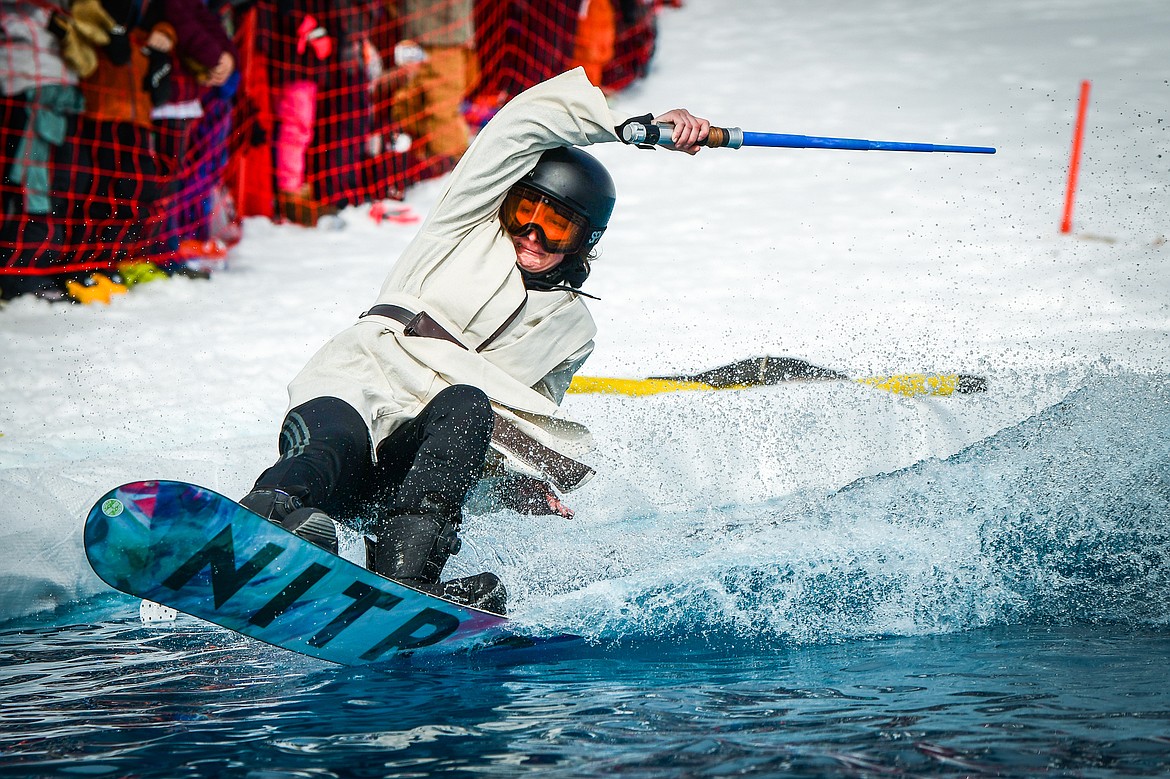 A competitor crashes into the water at Whitefish Mountain Resort's pond skim on Saturday, April 8. (Casey Kreider/Daily Inter Lake)