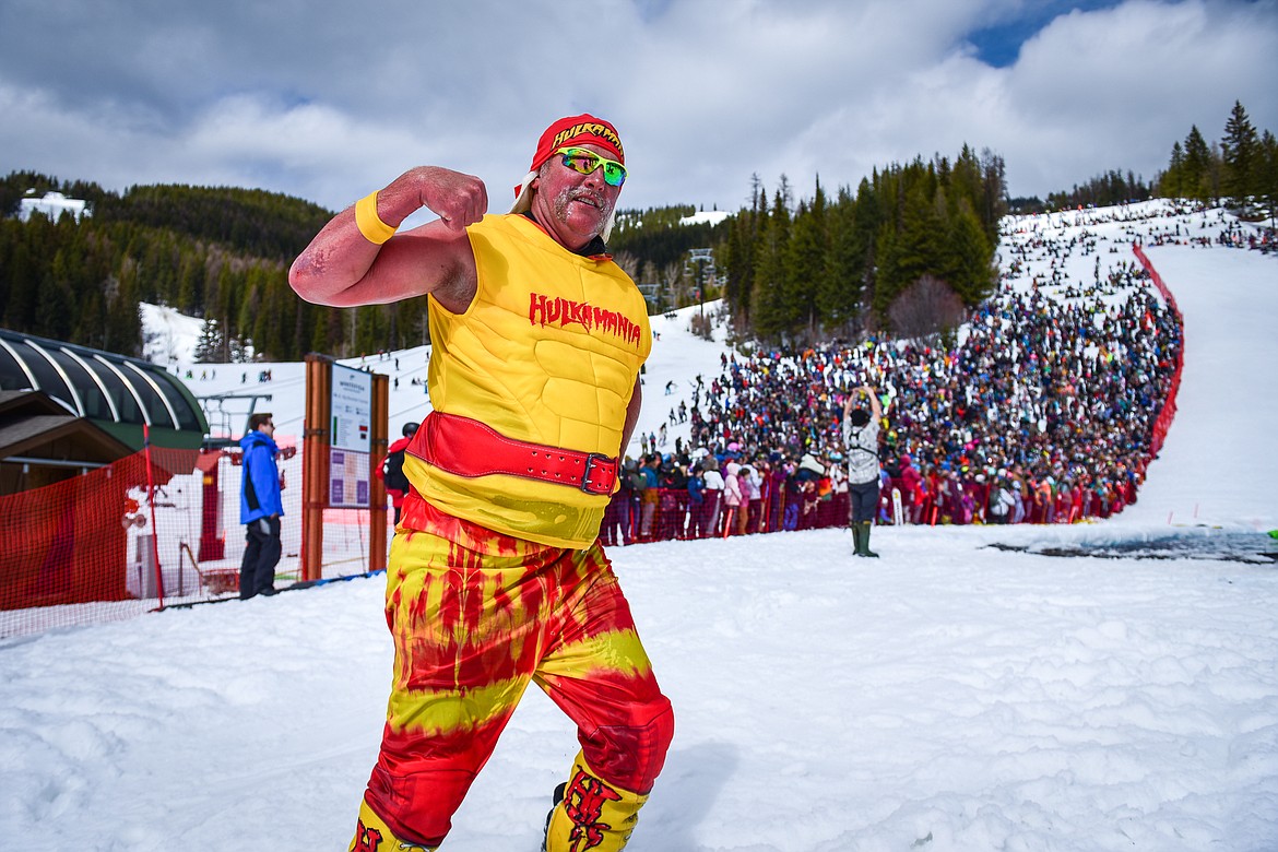 A competitor in a Hulk Hogan costume celebrates after a run at Whitefish Mountain Resort's pond skim on Saturday, April 8. (Casey Kreider/Daily Inter Lake)