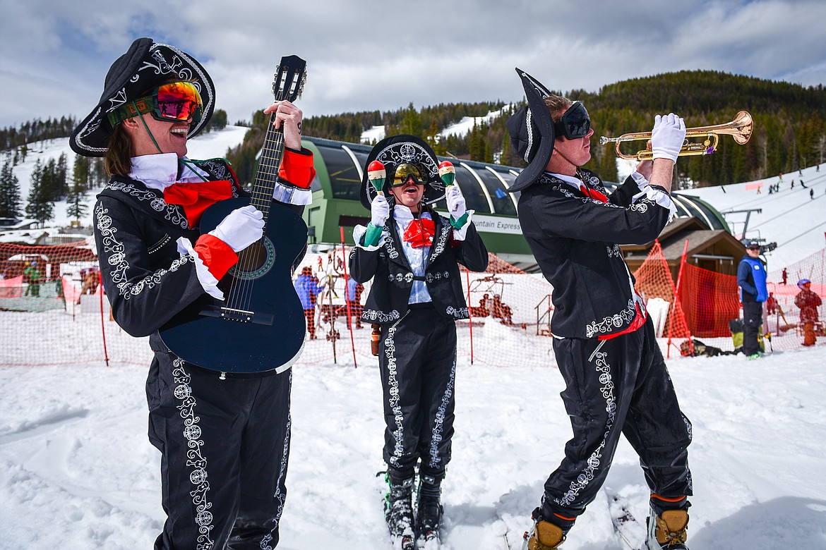 Competitors in mariachi costumes celebrate after a run at Whitefish Mountain Resort's pond skim on Saturday, April 8. (Casey Kreider/Daily Inter Lake)