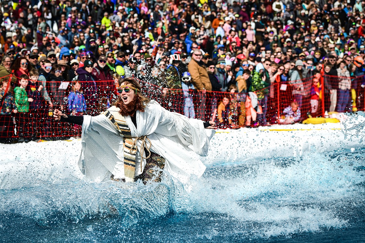 A competitor comes up short of successfully crossing the water at Whitefish Mountain Resort's pond skim on Saturday, April 8. (Casey Kreider/Daily Inter Lake)