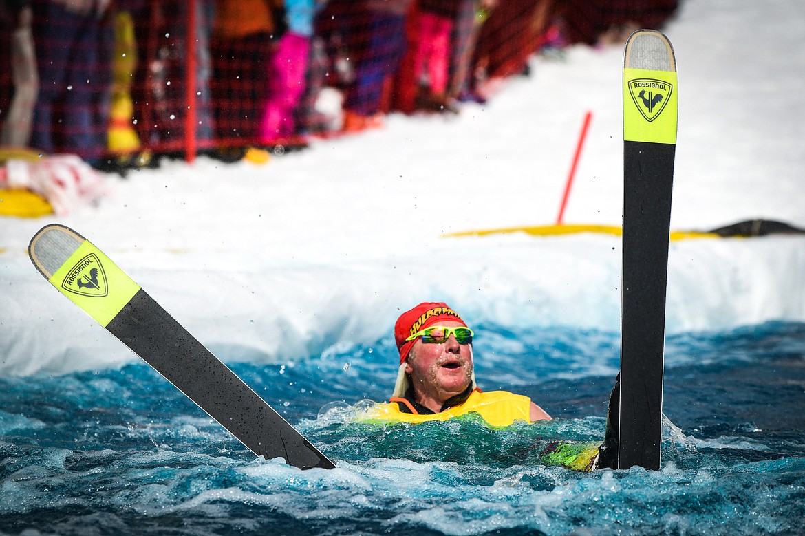 A competitor in a Hulk Hogan costume reacts after crashing into the water at Whitefish Mountain Resort's pond skim on Saturday, April 8. (Casey Kreider/Daily Inter Lake)