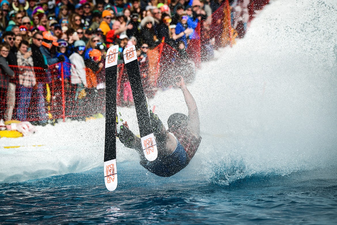 A competitor crashes into the water at Whitefish Mountain Resort's pond skim on Saturday, April 8. (Casey Kreider/Daily Inter Lake)